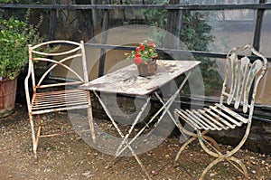 outdoors Country style shabby-chic old tonal white furniture in the glasshouse