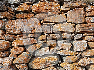 Country wall rocky stones texture with lichens