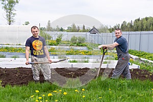 Country of work. In the country, father and son cultivate the land.