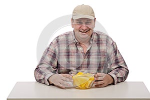 A countryman shows juicy yellow watermelon