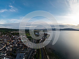 Countryside, aerial view on houses near coast of Irish sea in Belfast Northern Ireland. Cloudy sky above seaside