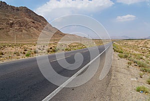 Countryside asphalt road circa Yazd, Iran.