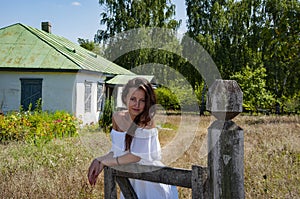 Countryside beautiful woman in summer at village cottage house outdoor