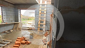 Countryside brick house under construction. Clip. Interior of unbuilt cottage with brick walls and space for windows