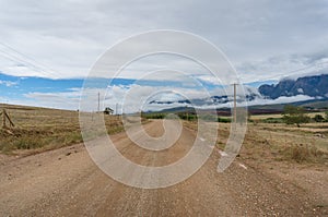 Countryside dirt road landscape. Rural travel with unsealed road background