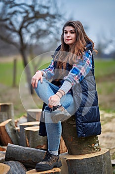 Countryside girl in jeans and plaid shirt