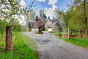 Countryside house exterior. View of entrance and gravel driveway