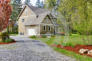Countryside house exterior. View of entrance and gravel driveway