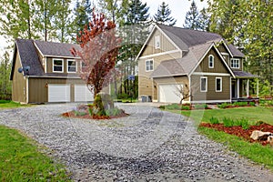 Countryside house exterior. View of entrance and gravel driveway