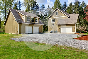 Countryside house exterior. View of entrance and gravel driveway