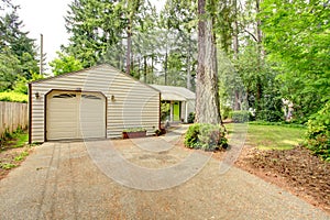 Countryside house. Garage with driveway