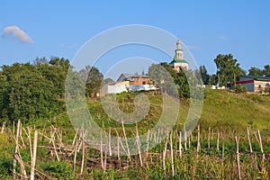 Countryside landscape with abandoned aged Orthodox Church on the hill in Russia hinterland.