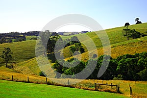 Countryside landscape with blue sky and mountains