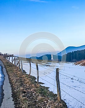 Countryside landscape scenery with melting snow and view on the mountains from a walking road in germany hochsauerland