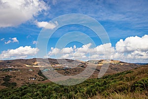 Countryside mountainous landscape with bright blue sky at morning from flat angle