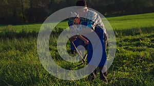 In the countryside mowing with scythe