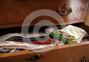 Countryside Old Clothing in Drawer, Western Vintage Rural Furniture. Patterns in Ancient Wooden Desk. Country Style Still Life.