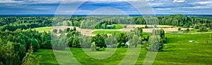 Countryside panorama of green field