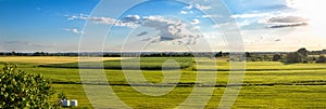 Countryside panorama of green field