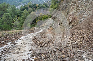 Countryside road blocked by a rockfall in mountain area of Cyprus photo