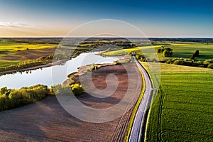 Countryside road through fields, aerial