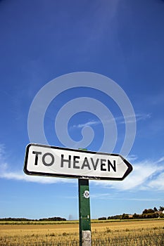 In the countryside a road sign with the inscription heaven.