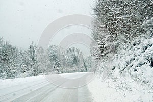 Countryside road during a snowfall.