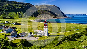 Countryside road to the sea in summer in Alnes, godoy island, Norway. Aerial shot from drone of norway landscape