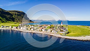 Countryside road to the sea in summer in Alnes, godoy island, Norway. Aerial shot from drone of norway landscape