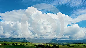 Countryside rural clouds Timelapse. Tropical scenery. Motion at blue sky.