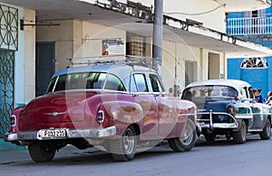 In the countryside in series parked vintage car in Cuba