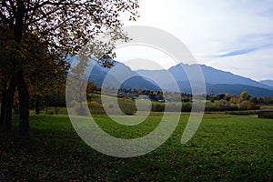 Countryside view in Levico, Trentino, Italy during autumn. fall season scenary with mountains and fiels