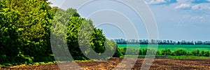 Countryside View of Ploughed Farmland in Spring photo