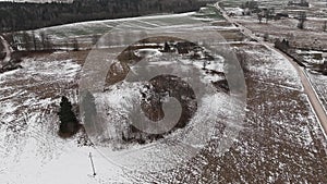 Countryside view with ploved agriculture fields and farm