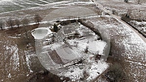 Countryside view with ploved agriculture fields and farm