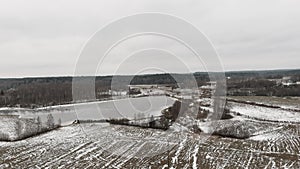 Countryside view with ploved agriculture fields and farm