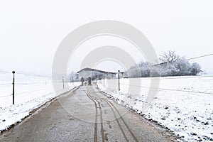 Countryside winter landscape with street