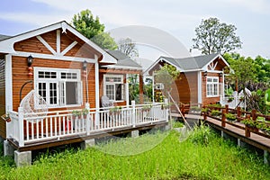 Countryside wooden cabins in sunny summer