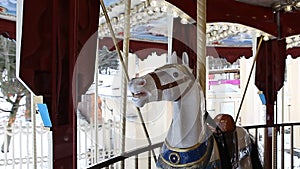 County fair fairground merry-go-round at daytime in winter