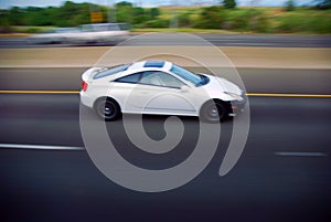 Coupe sports car on freeway