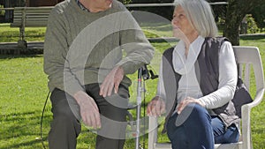 Couple of active seniors talking outdoor