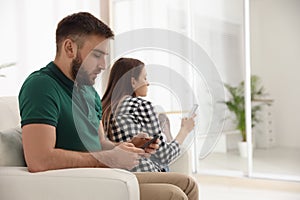Couple addicted to smartphones. Relationship problems