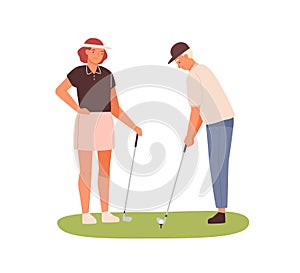 Couple of adults playing golf together. Woman in cap visor holding golf club and man aiming. Summer sport outdoor game