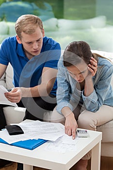 Couple analyzing home budget