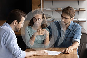 Couple of angry tenants having dispute with real estate agent