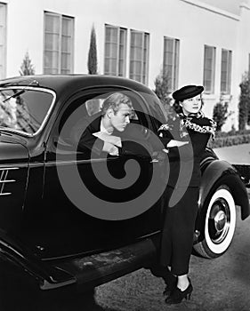 Couple with antique car