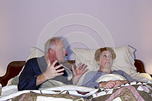 Couple Arguing in Bed
