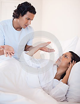 Couple arguing in the bedroom