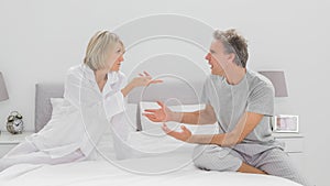 Couple arguing in bedroom