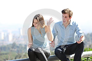 Couple arguing in a city outskirts